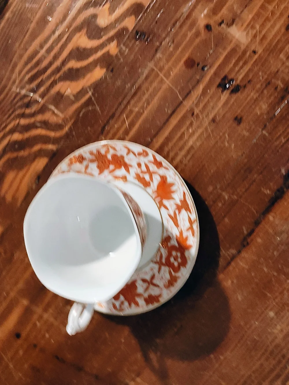 Porcelain Teacup and Saucer - White with Rust Floral Pattern